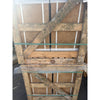 Weathered wooden pallet with visible grain and rustic texture secured by green plastic straps for noce brown travertine 12x24 cross-cut