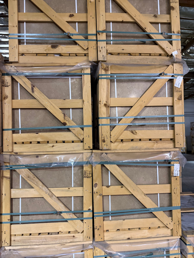 Noce brown travertine 24x24 cross-cut barn door with metal hardware and plastic wrap