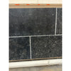 Obsidian Ash 16x24 honed limestone tiles in black textured stone with white grout