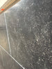 Polished Obsidian Ash 16x24 limestone tile with dark gray base and white speckles