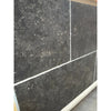 Obsidian Ash 16x24 honed limestone tiles in dark gray speckled texture with white grout