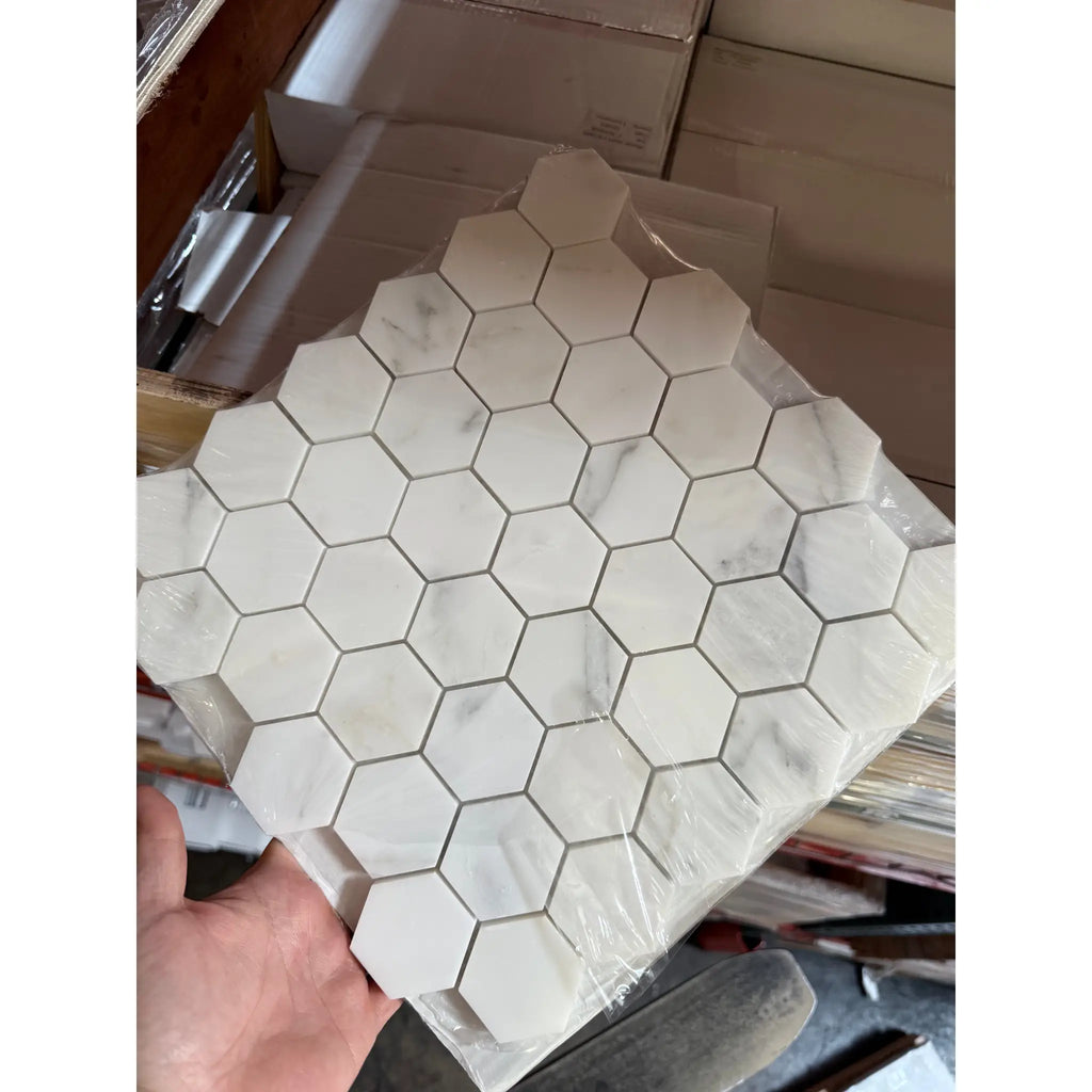 Hexagonal marble tile sheet featuring Oriental White Asian Statuary 2-inch polished mosaic