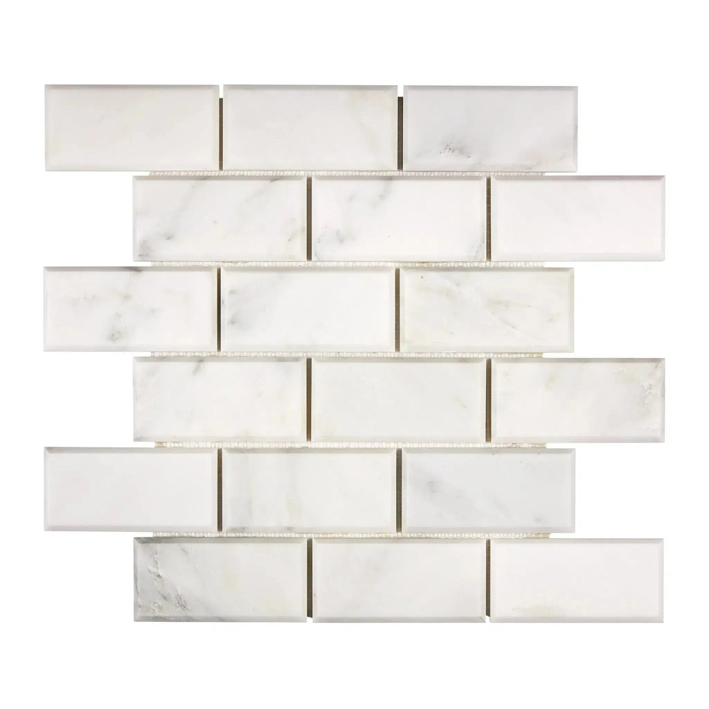 White marble subway tile in Oriental White Asian Statuary 2X4 Brick Deep-Beveled Mosaic