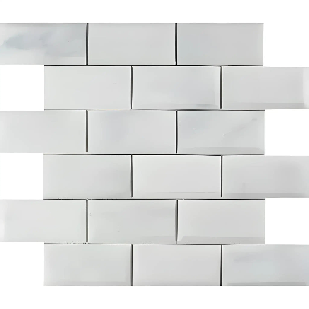 White marble subway tile in Oriental White Asian Statuary 2X4 brick mosaic design