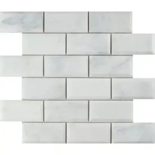 White marble subway tile in Oriental White Asian Statuary 2X4 brick mosaic design
