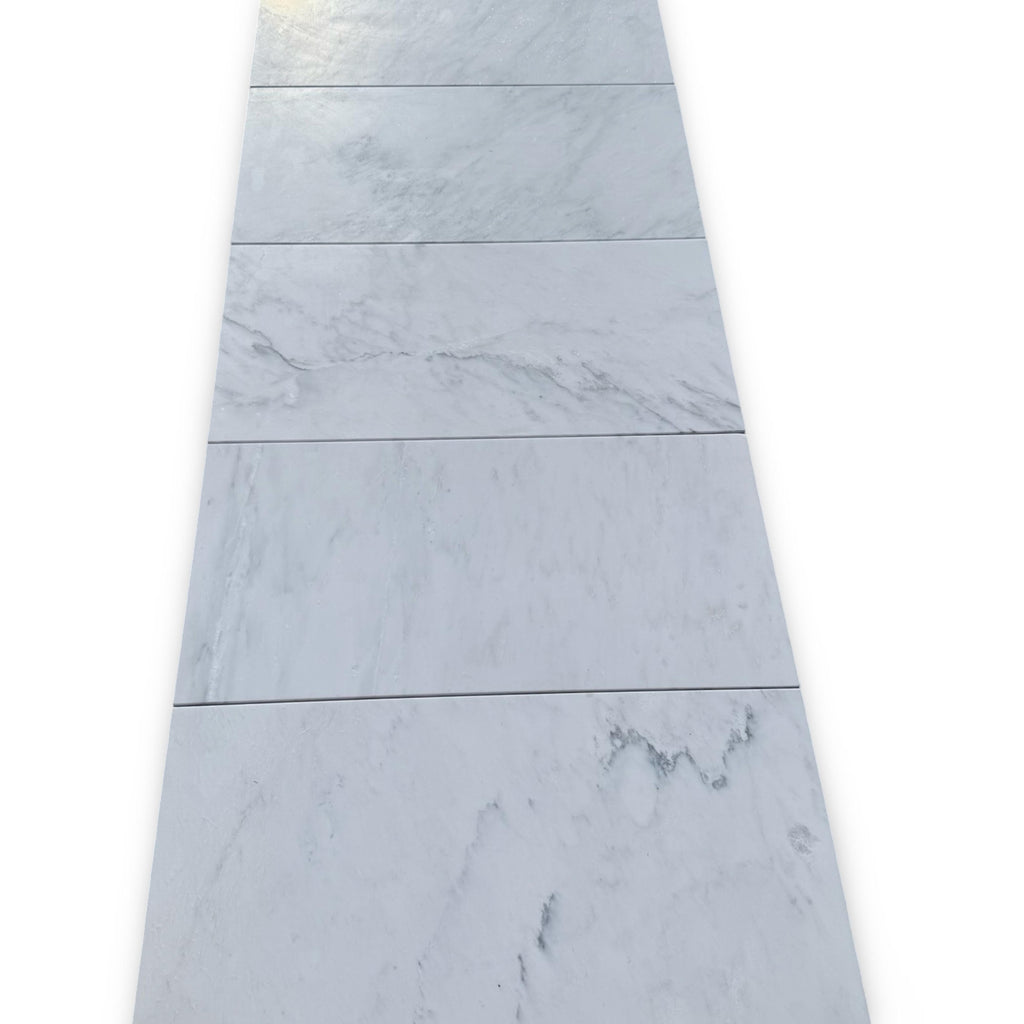 Rectangular marble floor tiles in Oriental White and Asian Statuary mosaic design