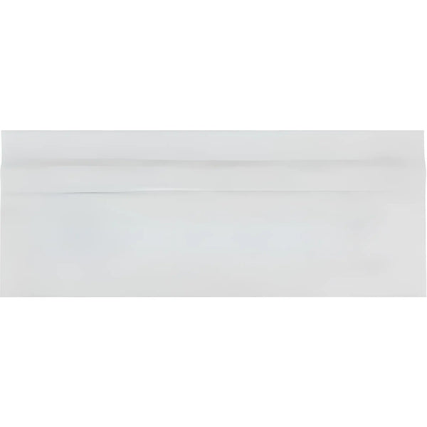 White business envelope displayed with Oriental White Asian Statuary baseboard trim