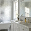 White marble bathroom vanity with dual sinks and silver hardware featuring oriental white asian statuary basketweave mosaic
