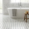 White freestanding bathtub with sleek modern chrome faucet in oriental white asian statuary basketweave blue-gray marble mosaic