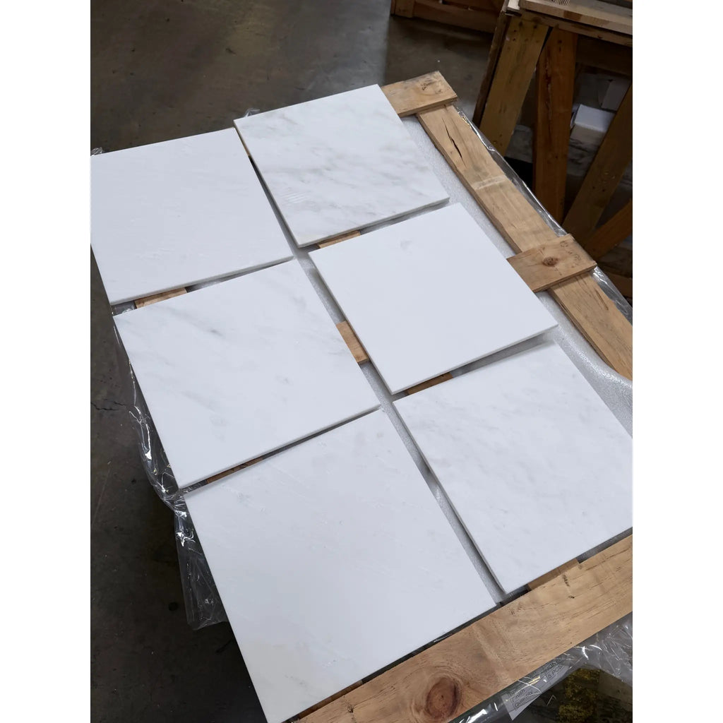 Six Oriental White marble 12x12 polished tiles on wooden pallet