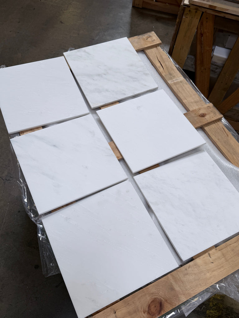 Six Oriental White marble 12x12 polished tiles on wooden pallet