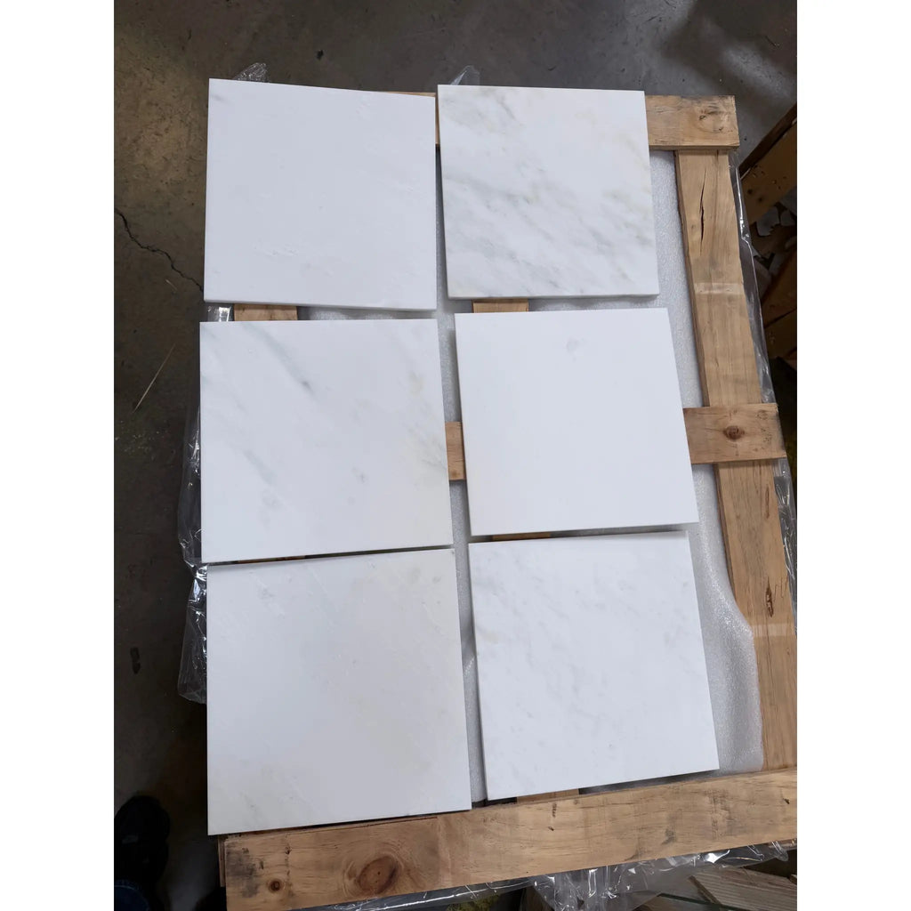 Six Oriental White marble 12x12 polished tiles on wooden pallet