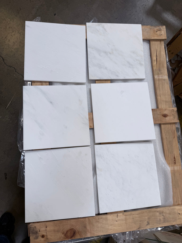 Six Oriental White marble 12x12 polished tiles on wooden pallet