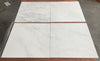 White marble tile with veining and natural patterns from Oriental White Asian Statuary Marble