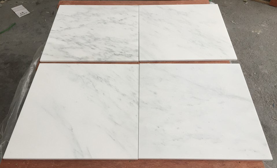 White marble tile with veining and natural patterns from Oriental White Asian Statuary Marble