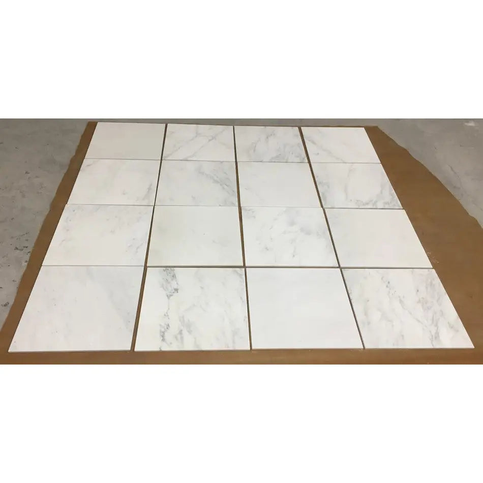 White marble tile floor mat with gray veining and grout lines from Oriental White Asian Statuary Marble 12X12