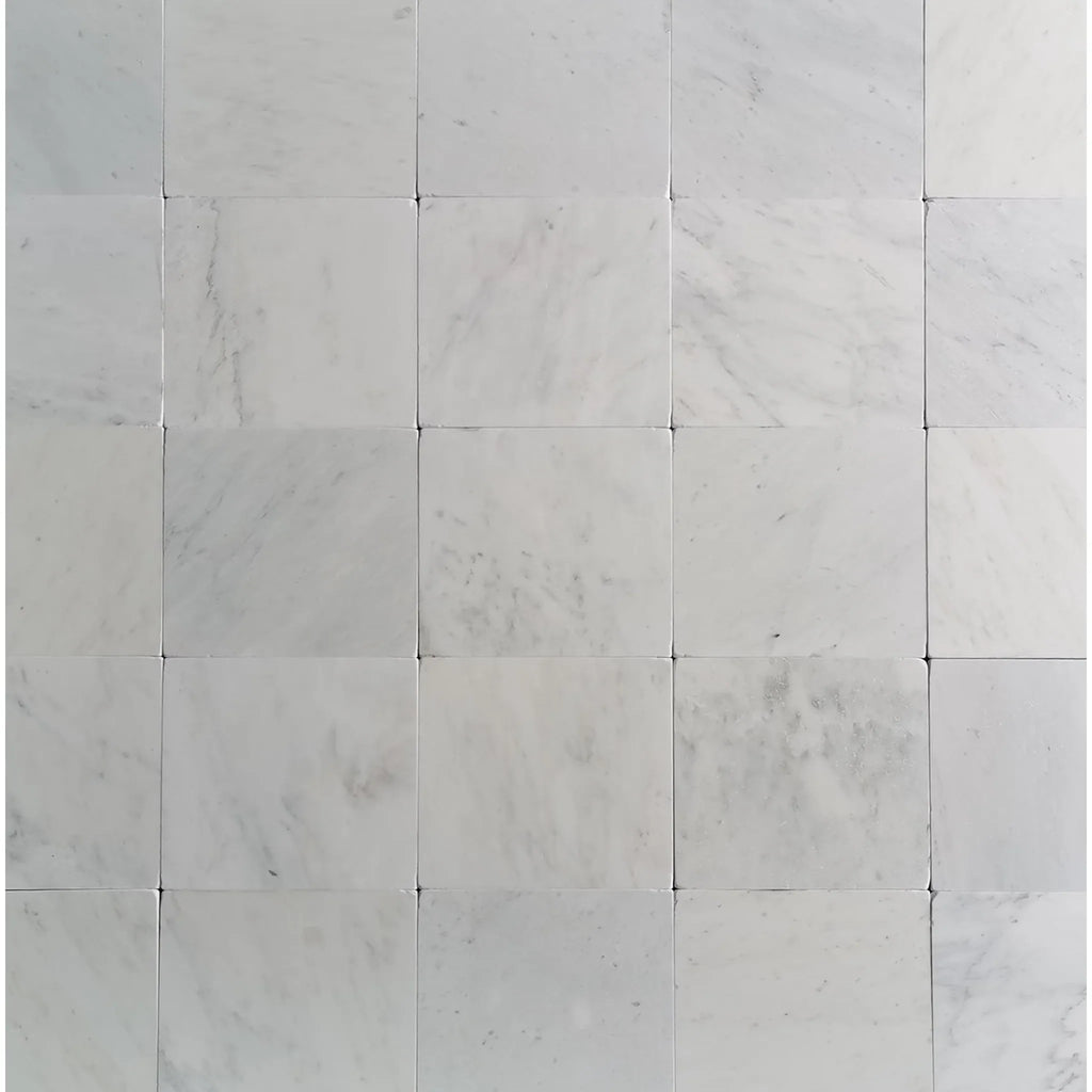 White marble tile grid featuring Oriental White Asian Statuary Marble 12x12 Tumbled