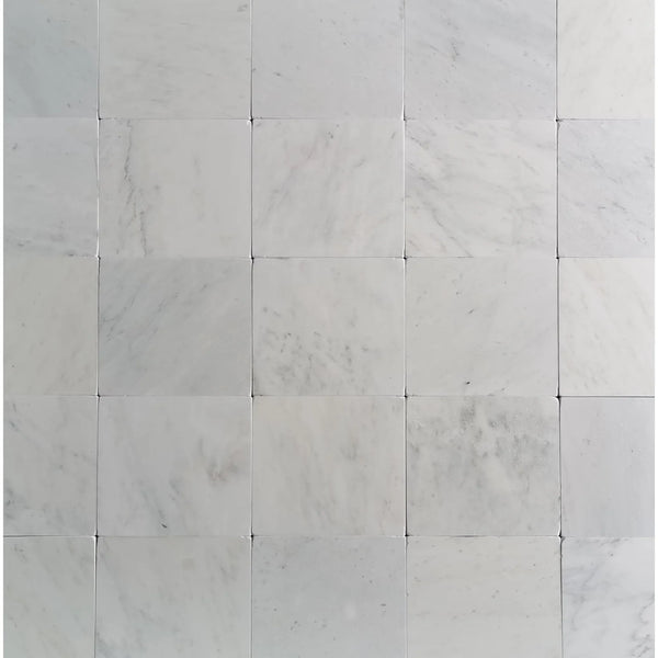 White marble tile grid featuring Oriental White Asian Statuary Marble 12x12 Tumbled