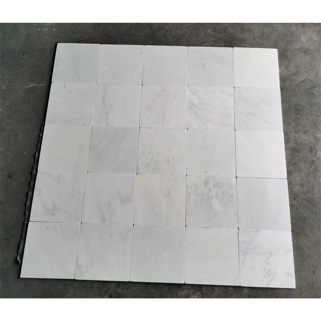White marble tile arrangement of Oriental White Asian Statuary Marble 12X12 Tumbled
