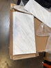 Stacked white marble-patterned tiles in a cardboard box for Oriental White Asian Statuary Marble