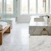 White marble bathroom vanity with rectangular sink and polished brass towel ring featuring oriental white asian statuary marble tiles
