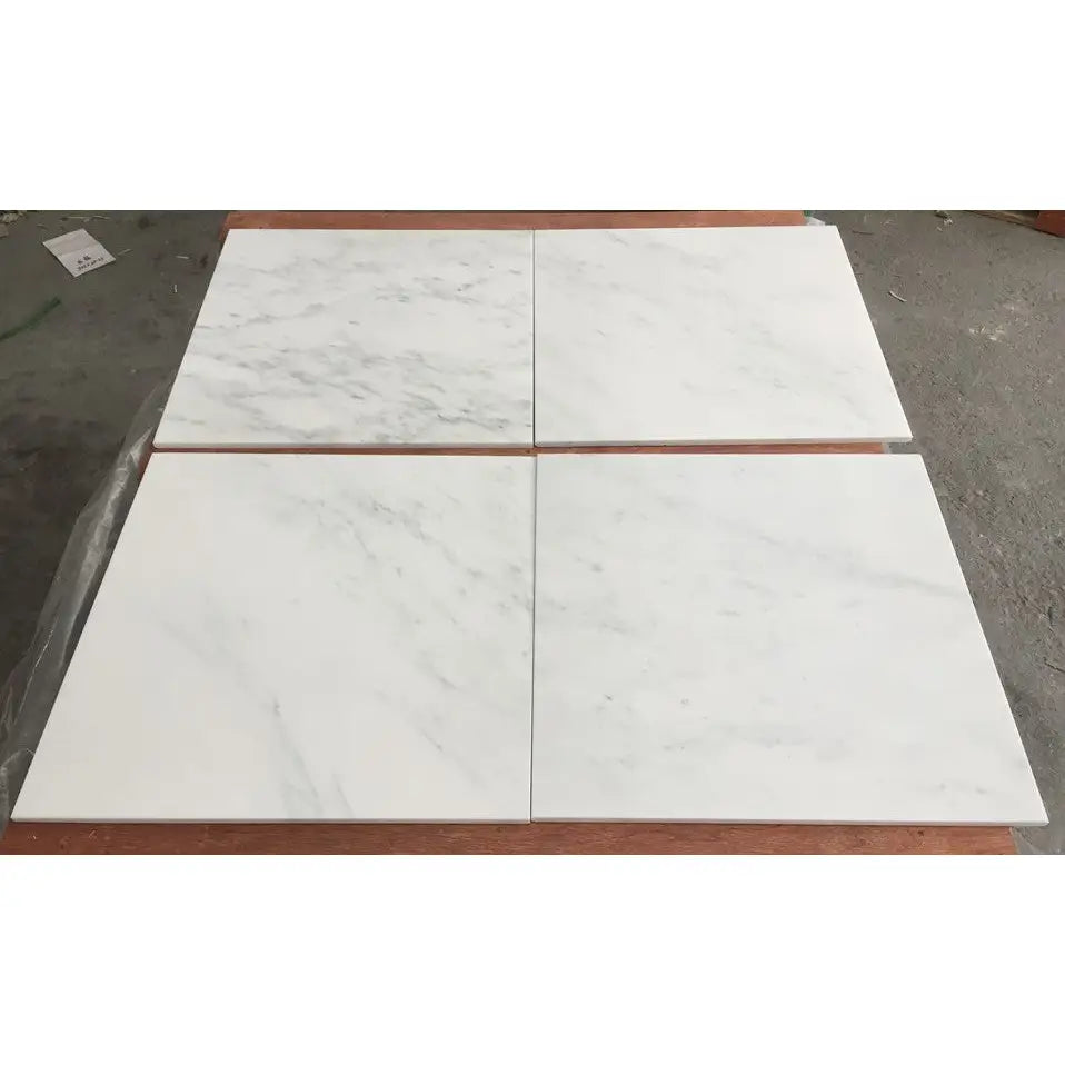White marble tile with veining and natural patterns from Oriental White Asian Statuary Marble collection