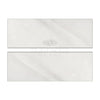 Two light-colored rectangular tiles of Oriental White Asian Statuary Marble 4X12