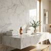 White marble vanity in oriental white asian statuary marble with sleek modern sink and integrated faucet 6x12 polished