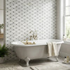 Oriental white Asian statuary octave marble mosaic with blue-gray polished hexagonal tile beside clawfoot bathtub