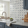 Oriental white asian statuary pinwheel mosaic marble tile backsplash in white and gray with a woven pattern polished or honed