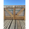 Wooden crate with light-colored Philadelphia Travertine 18x18 tiles secured with green straps