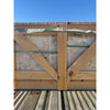 Wooden crate secured with green straps holding Philadelphia Travertine 18X18 filled and honed stone slab