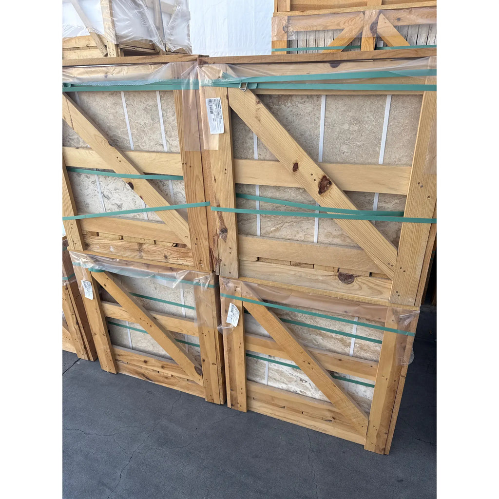 Wooden crates containing Philadelphia Travertine 24X24 Filled and Honed stone tiles