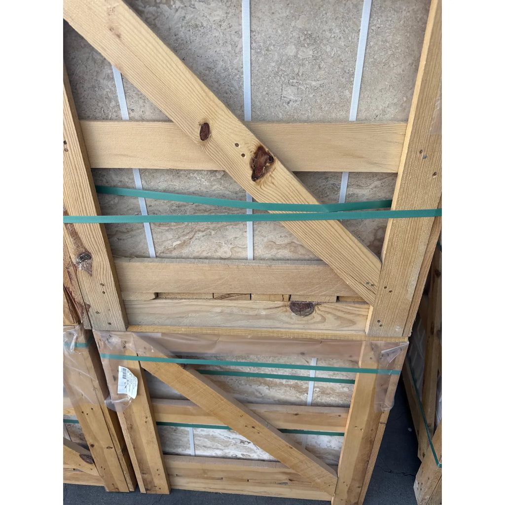 Wooden-framed stone tile pallets featuring Philadelphia Travertine 24X24 Filled and Honed