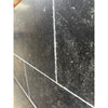 Pietra Notte Marble 16x24 black speckled tile with white grout