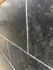 Pietra Notte Marble 16x24 black speckled tile with white grout