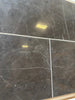 Dark gray Pietra Notte marble 16x24 tiles with subtle white veining