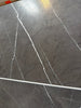 Dark gray Pietra Notte marble tile with elegant white veining, 16x24