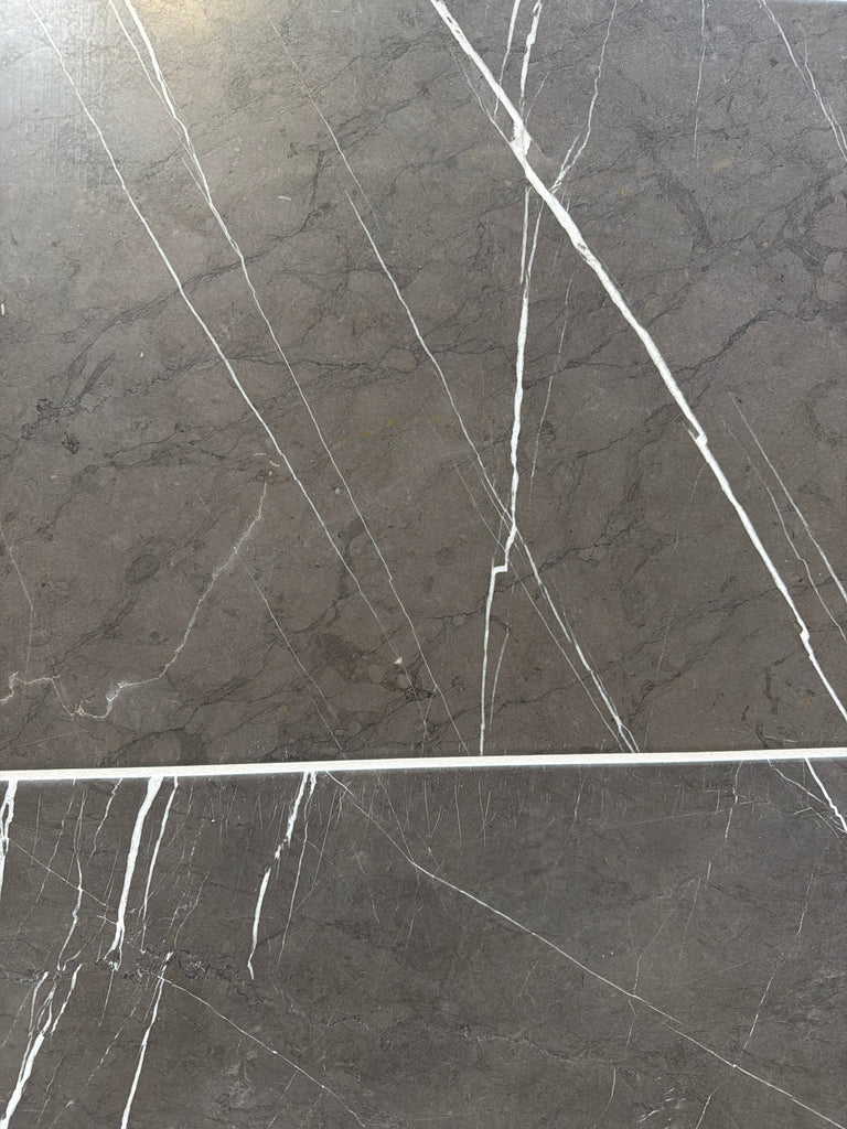 Dark gray Pietra Notte Marble 16x24 tile with elegant white veining