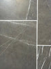 Pietra Notte dark gray marble 16x24 tiles with white veining