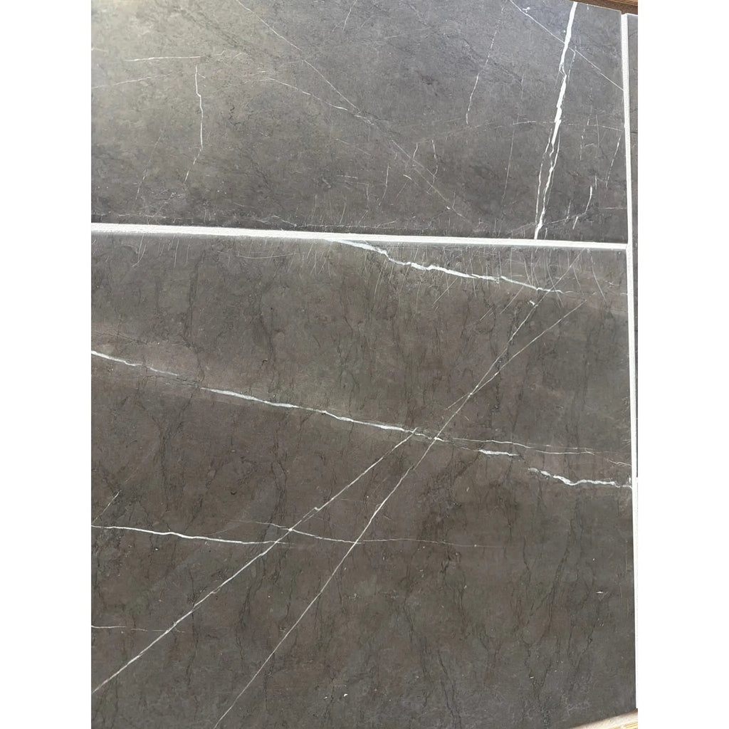 Dark gray Pietra Notte marble tile with elegant white veining, 16x24 size