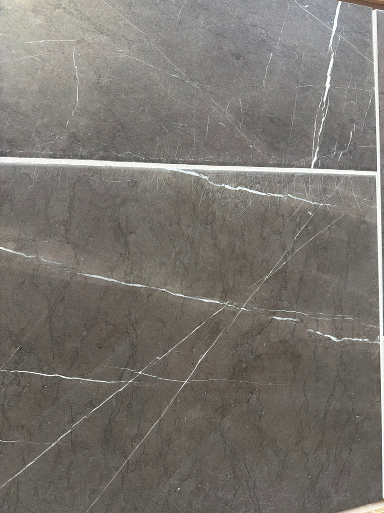 Dark gray Pietra Notte marble tile with elegant white veining, 16x24 size