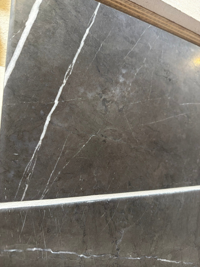 Dark gray Pietra Notte Marble 16x24 tile with subtle white veining