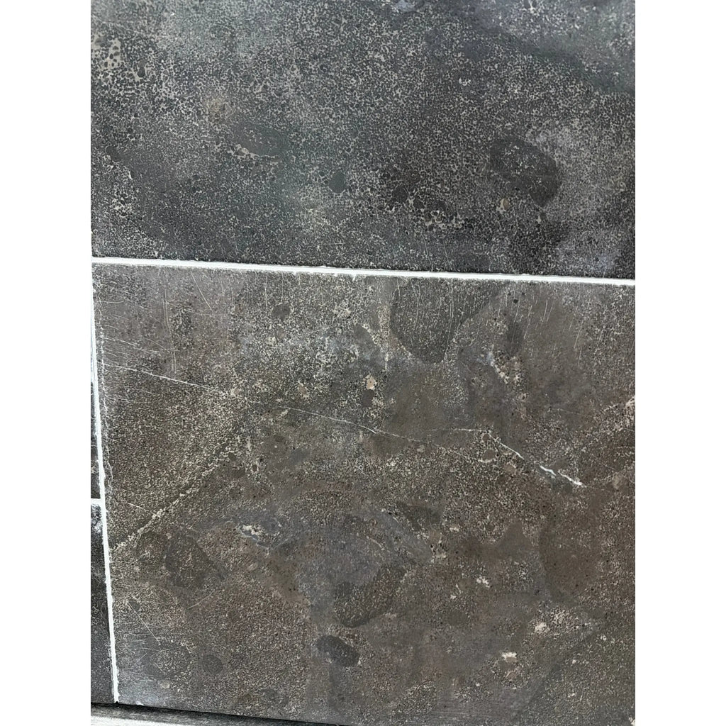 Pietra Notte Marble 16x24 tile with dark gray stone, subtle veining, matte finish