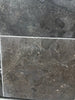 Pietra Notte Marble 16x24 tile with dark gray stone, subtle veining, matte finish