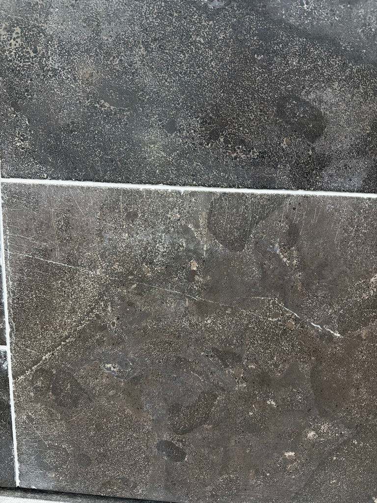 Pietra Notte Marble 16x24 tile with dark gray stone, subtle veining, matte finish
