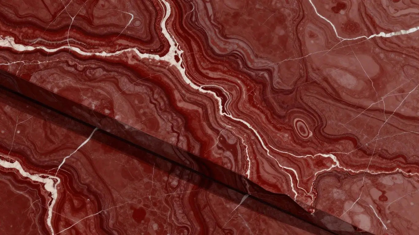 Polished slab of Rojo Alicante marble with deep red veins.