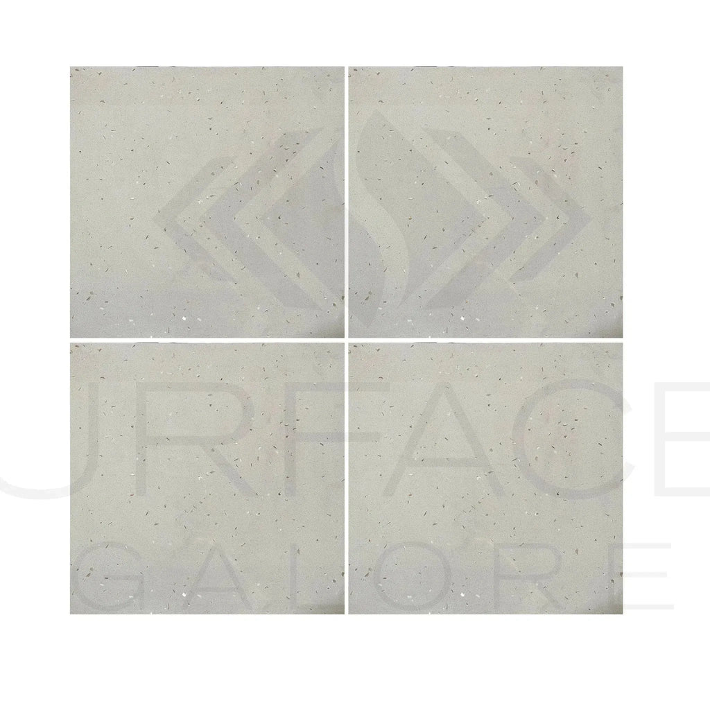 Four light-colored speckled Riviera Quartz tiles for polished flooring