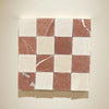 Checkerboard pattern of Rojo Alicante 3X3 Tumbled marble tiles showcasing elegance
