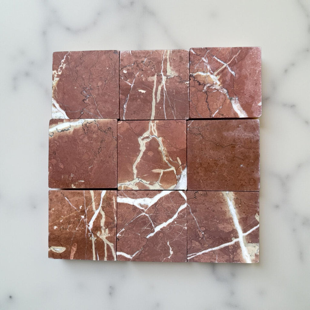 Reddish-brown marble tiles with white veining in a 4x4 grid for Rojo Alicante Tumbled
